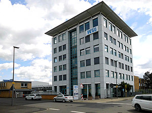 Mehrgeschossiges Verwaltungsgebäude mit Logo WEGU, 2021